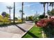 The community entrance features tall trees, desert plants and paved driveways at 2929 W Yorkshire Dr # 1028, Phoenix, AZ 85027
