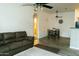 Inviting living room with a comfortable sofa, ceiling fans, and a view into other rooms at 2929 W Yorkshire Dr # 1028, Phoenix, AZ 85027