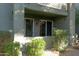 This outdoor patio features a covered area with sliding doors and desert landscaping at 2929 W Yorkshire Dr # 1028, Phoenix, AZ 85027