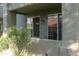 Covered patio with dual sliding doors and desert landscaping with small plants at 2929 W Yorkshire Dr # 1028, Phoenix, AZ 85027