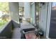 Enclosed outdoor patio with small table and chairs and desert landscaping at 2929 W Yorkshire Dr # 1028, Phoenix, AZ 85027