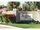 Community entrance sign surrounded by lush landscaping and beautiful flowers at 2929 W Yorkshire Dr # 1028, Phoenix, AZ 85027
