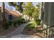 Exterior view of community walkway with mature landscaping and desert stone at 2929 W Yorkshire Dr # 1028, Phoenix, AZ 85027