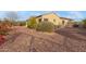 Desert landscaped backyard with mature trees, privacy bushes and decorative rocks at 30056 N 129Th Ave, Peoria, AZ 85383
