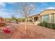Low maintenance backyard featuring mature trees, bushes, and a patio with a built-in grill at 30056 N 129Th Ave, Peoria, AZ 85383