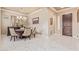 Dining room featuring white marble floors, a round table and neutral walls at 30056 N 129Th Ave, Peoria, AZ 85383