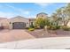 A charming home with a well-maintained yard, two-car garage, and inviting curb appeal at 30056 N 129Th Ave, Peoria, AZ 85383