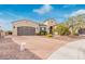A beautiful single Gathering home with a spacious driveway and desert landscaping at 30056 N 129Th Ave, Peoria, AZ 85383