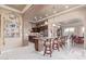 Open concept kitchen with a large island, barstool seating, and stainless steel appliances at 30056 N 129Th Ave, Peoria, AZ 85383
