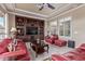 Living room featuring tile floors, neutral paint and a media center at 30056 N 129Th Ave, Peoria, AZ 85383