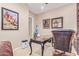 Office space featuring an elegant desk, leather office chair, and decorative wall art at 30056 N 129Th Ave, Peoria, AZ 85383