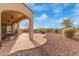 View of a spacious outdoor patio area with brick pavers, comfortable seating, and a relaxing fire pit at 30056 N 129Th Ave, Peoria, AZ 85383