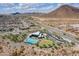 Aerial view of community pool in the desert at 31489 N 126Th Ln, Peoria, AZ 85383