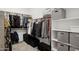 Organized walk-in closet with shelves and hanging rods for ample storage at 31489 N 126Th Ln, Peoria, AZ 85383