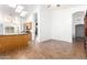 Bright, open kitchen with ample counter space, wooden cabinetry, and a view of the dining area at 3161 W Frankfurt Dr, Chandler, AZ 85226