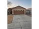 Charming single-story home with desert landscaping and attached two-car garage at 32974 N Sandstone Dr, San Tan Valley, AZ 85143