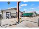 The backyard contains a garage with graffiti, an auto lift, and assorted backyard equipment at 3429 W Aire Libre Ave, Phoenix, AZ 85053