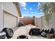 The backyard contains tires, a garage, and a concrete wall at 3429 W Aire Libre Ave, Phoenix, AZ 85053