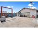 The backyard contains a garage with graffiti, a concrete slab, and assorted backyard equipment at 3429 W Aire Libre Ave, Phoenix, AZ 85053