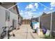 Backyard with a white tent, concrete floor, and various items stored along the side at 3429 W Aire Libre Ave, Phoenix, AZ 85053