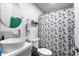 A bathroom with a vessel sink and butterfly-themed shower curtain at 3429 W Aire Libre Ave, Phoenix, AZ 85053