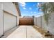 Concrete driveway leading to a detached garage with potential for RV parking at 3429 W Aire Libre Ave, Phoenix, AZ 85053