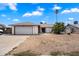 Charming single-story home with a two-car garage and a low maintenance desert-style yard at 3429 W Aire Libre Ave, Phoenix, AZ 85053