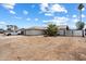 Exterior view of a home with desert landscaping and a fenced front yard with gate at 3429 W Aire Libre Ave, Phoenix, AZ 85053