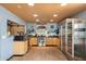 Functional kitchen with stainless steel appliances and tile floors offering style and convenience at 3429 W Aire Libre Ave, Phoenix, AZ 85053