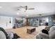 Spacious living room with an electric fireplace and a convenient bar area for entertaining at 3429 W Aire Libre Ave, Phoenix, AZ 85053