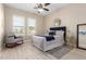 Bedroom featuring hardwood flooring, a window with natural light, and a chair at 3749 E Riopelle Ave, Gilbert, AZ 85298