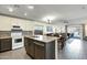 Modern kitchen with stainless steel appliances, granite countertops, and an open layout at 3860 E Sundance Ave, Gilbert, AZ 85297