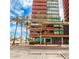 Contemporary high-rise building featuring modern architectural design and lush landscaping at 4808 N 24Th St # 925, Phoenix, AZ 85016