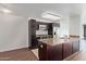 Modern kitchen with stainless steel appliances, granite counters, and an island with bar seating at 4808 N 24Th St # 925, Phoenix, AZ 85016