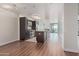 Modern kitchen features dark wood cabinets, stainless steel appliances, and an island with granite countertops at 4808 N 24Th St # 925, Phoenix, AZ 85016