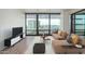 Comfortable living area with a couch, sleek furnishings, and a beautiful city view at 4808 N 24Th St # 925, Phoenix, AZ 85016
