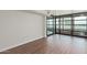 Open living room featuring hardwood floors and sliding glass door to the balcony at 4808 N 24Th St # 925, Phoenix, AZ 85016