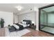 Modern main bedroom featuring a decorative rug, stylish furniture, and large windows for ample natural light at 4808 N 24Th St # 925, Phoenix, AZ 85016