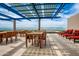 Relaxing rooftop deck features outdoor dining, sun loungers, and panoramic city views at 4808 N 24Th St # 925, Phoenix, AZ 85016