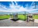 Luxurious rooftop grilling area complete with stainless steel grills, counter space, and glass railing at 4808 N 24Th St # 925, Phoenix, AZ 85016