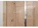 Close up of tiled shower with glass door, shelving and modern fixture at 4808 N 24Th St # 925, Phoenix, AZ 85016
