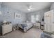 Cozy bedroom with seashell themed decor, a ceiling fan, and a comfortable bed at 5478 E Oakhurst Way, Scottsdale, AZ 85254