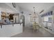 Inviting dining area with natural light, chandelier, and views into the kitchen at 5478 E Oakhurst Way, Scottsdale, AZ 85254