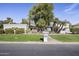 Charming single-story home with lush landscaping, mature trees and a well-manicured front yard at 5478 E Oakhurst Way, Scottsdale, AZ 85254