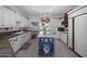 Well-lit kitchen with white cabinetry, center island, and modern appliances at 5478 E Oakhurst Way, Scottsdale, AZ 85254