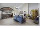 Warm living room with fireplace and custom bar with comfortable seating for entertaining at 5478 E Oakhurst Way, Scottsdale, AZ 85254