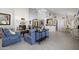 Bright living room features a white fireplace, neutral tile, and an open floor plan at 5478 E Oakhurst Way, Scottsdale, AZ 85254
