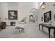 Elegant living room featuring a fireplace, piano and stylish decor with lots of natural light at 5478 E Oakhurst Way, Scottsdale, AZ 85254