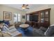 Comfortable Gathering room with custom built-ins, a large TV, and plush seating at 5478 E Oakhurst Way, Scottsdale, AZ 85254