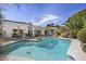 Beautiful swimming pool with attached spa and decorative turtle, surrounded by outdoor furniture at 5478 E Oakhurst Way, Scottsdale, AZ 85254